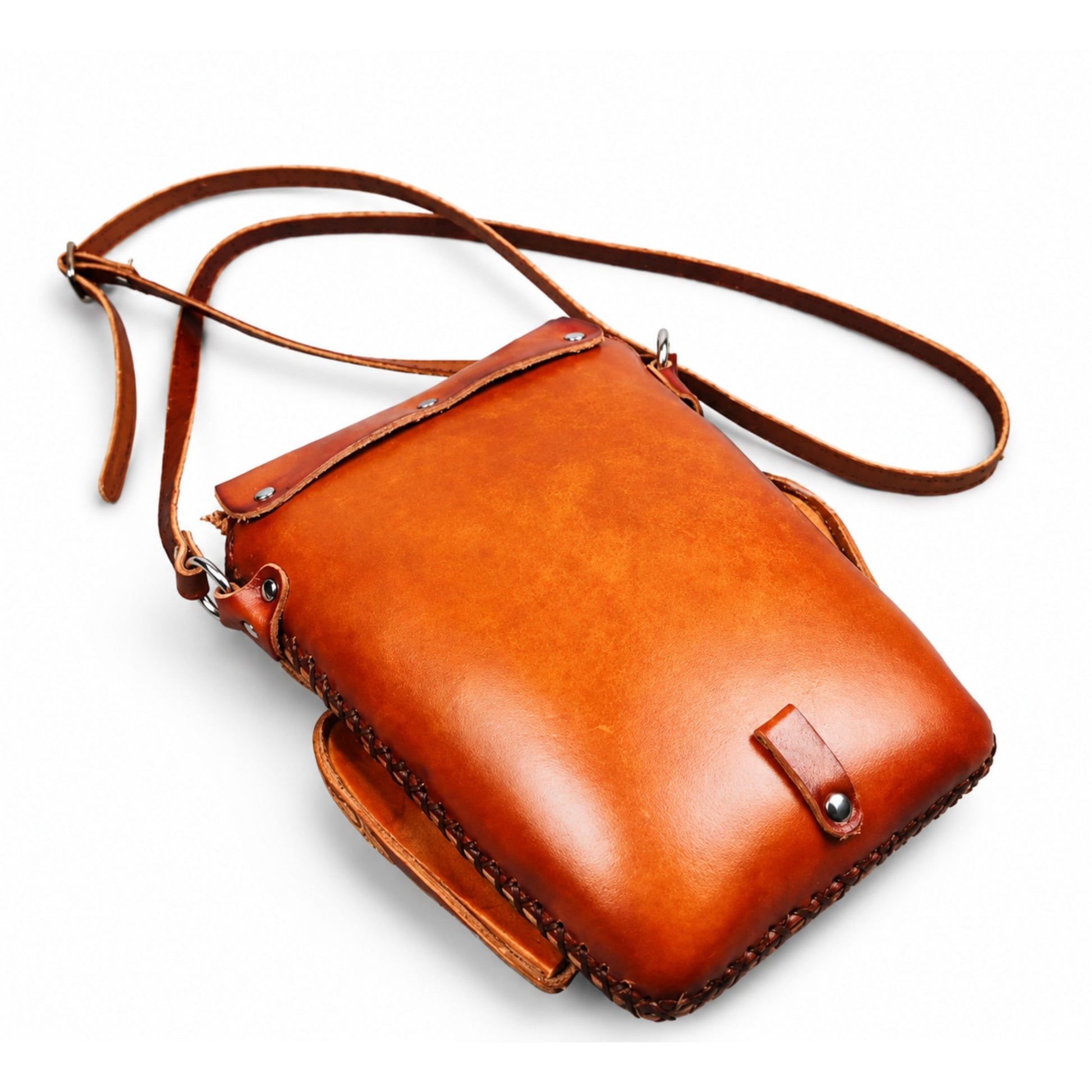 Brown leather crossbody bag on a white background